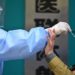 China threatens to ban unvaccinated adults from schools, hospitals