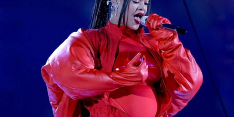 Rihanna performs hits at Super Bowl, reveals baby bump