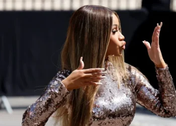 Rapper Cardi B, the target of a thrown liquid, retaliates