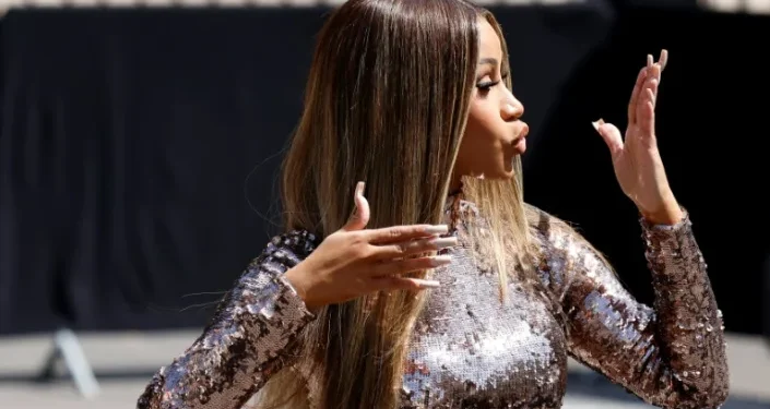 Rapper Cardi B, the target of a thrown liquid, retaliates