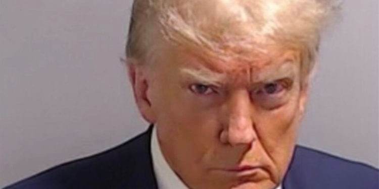 Trump arrested in election case, mug shot released