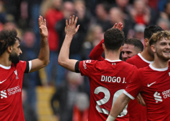 Salah double downs 10-man Everton in controversial Merseyside derby