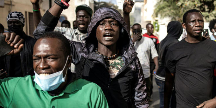 Clashes as Senegal parliament delays presidential poll