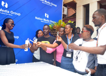 NMG-U staff commemorate International AIDS Candlelight Memorial